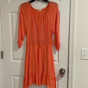 Coral dress with embroidery in the front and along the sleeves. Worn once only.